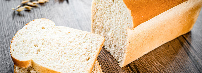 Whole Grain Healthy Sandwich Bread Square Slices, Supermarket Bread for Toasts, Soft Sandwich Loaf Pieces on wooden Background wheat bread