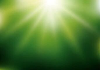 Obraz premium A vibrant, soft-focus backdrop featuring radiating light and a gradient of lush green tones, creating a peaceful and tranquil atmosphere.