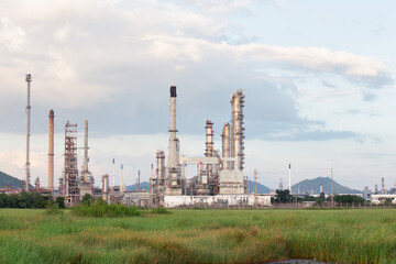 Oil gas refinery plant. May called petroleum, production or petrochemical plant. Include gas flare or flare stack. Industrial factory construction from engineering technology by steel, pipe, pipeline.
