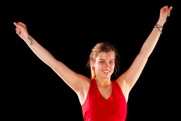 Young and beautiful woman at studio with black backgound
