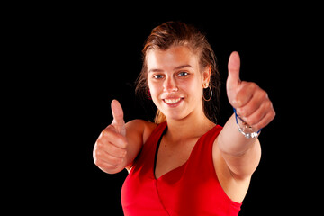 Young and beautiful woman at studio with black backgound