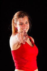 Young and beautiful woman at studio with black backgound