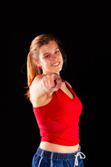 Young and beautiful woman at studio with black backgound