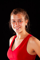 Young and beautiful woman at studio with black backgound