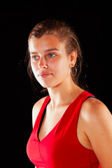 Young and beautiful woman at studio with black backgound