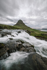 Kirkjufellsfoss Waterfall With Kirkjufell Mountain Near Grundarfjordur City, Iceland