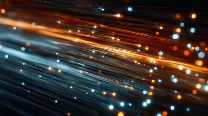 Dynamic fiber optic strands create stunning abstract light trails in vibrant orange and blue hues perfect for technology