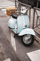 Classic blue scooter on the street - vintage transport