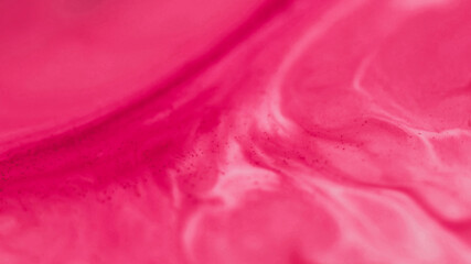 Ink particles. Acrylic fluid. Defocused pink color liquid texture chemical enamel marble water leaking on abstract art background.
