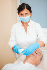 Laser resurfacing and peeling of facial skin - cosmetic medical procedure in a beauty salon
