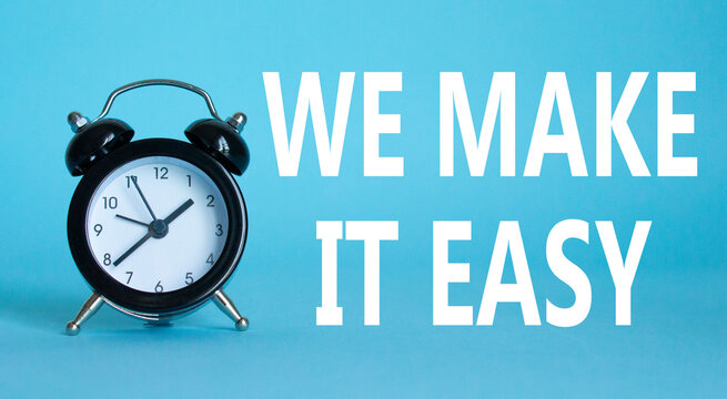 We make it easy symbol. Beautiful blue background with alarm clock with words We make it easy. Business concept. Copy space.