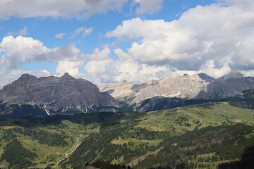 Trentino, Italy - July 29, 2025: Stunning Alpine scenery of breathtaking Dolomites rocks mountains in Italian Alps. Marmolada glacier seen in the distance from the slopes of the Porta Vescovo Dolomite