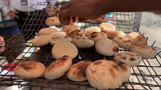 Litti chokha being roasted in terracotta stove in Bihar