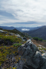 Panoramic Mountain Landscape View of Lago Moquehue from Cerro Impodi with Andean Forest and Rocky Slopes in Villa Pehuenia Patagonia Argentina