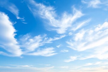 Fototapeta premium Stunning Wide-Angle Capture of an Expansive Sky, Featuring a Gradient of Blues and Fluffy White Clouds, Evoking a Sense of Serenity and Tranquility for Nature-Inspired Projects