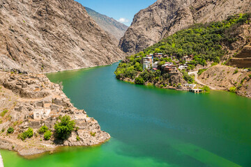 14 July 2025 Tortum Erzurum. Tortum waterfall, tortum dam, lake and fish farms on the lake on a sunny day.