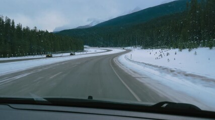 Traveling East on the Banff Parkway on a clear but snowy winter day, Part 2 - Powered by Adobe