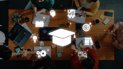 A vibrant workspace where individuals collaborate on educational projects using technology and professional tools to enhance learning and share innovative ideas. Raster