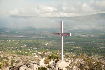Pink cross in the hill at sunset. Alt de Ponce, Bocairent, Comunidad Valenciana (Spain)