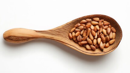Roasted pine nuts in a wooden spoon isolated on white background, a healthy and delicious snack, perfect for adding a nutty flavor to your meals
