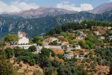 Fototapeta premium Church and chapel of Agios Mamas in Lakkoi village in Crete mountains on sunny day