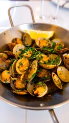 Pan-seared clams with lemon and herbs