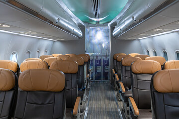 Empty airplane cabin with leather seats