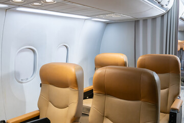 Empty airplane cabin with leather seats