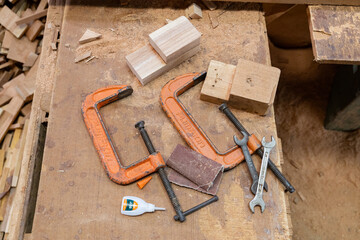 Old industrial radial arm saw in woodshop