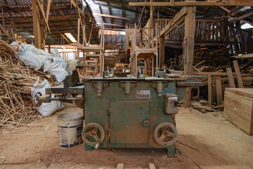 Fototapeta premium Old industrial radial arm saw in woodshop