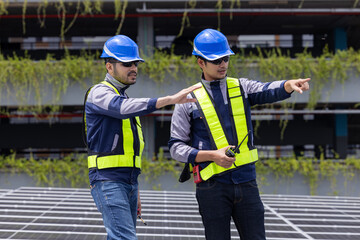 Engineers analyzing rooftop solar panel system data