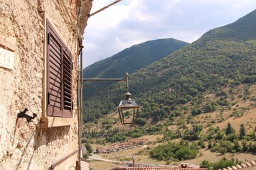 Rustic stone house with lantern and valley view