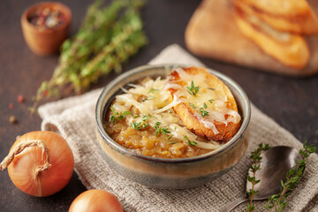 Classic French onion soup baked with cheese croutons sprinkled with fresh thyme.