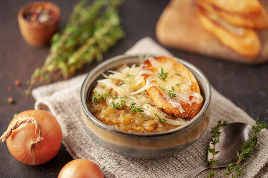 Classic French onion soup baked with cheese croutons sprinkled with fresh thyme.