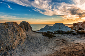 Kazakhstan, a place of Shekelmes coast of Lake Zaysan. The setting sun beautifully stains and...