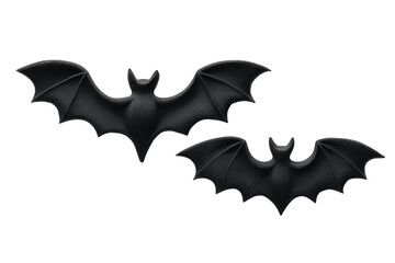 Fototapeta premium Two black bat silhouettes, paper cutouts, placed on clean white background, minimal flat lay.