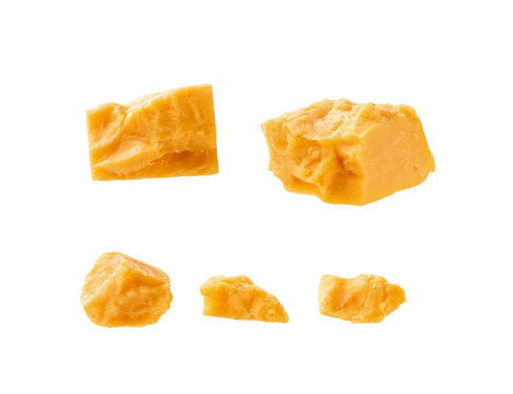 cheddar cheese cubes isolated on a white background.