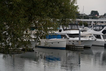 Reflections of boats docked in Waterfront marina