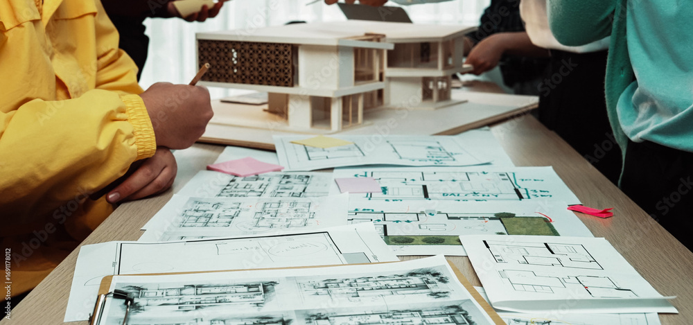 Poster engaging architecture studio scene showing diverse hands sketching blueprints, discussing innovative