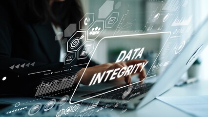 Professional Woman Working on Laptop with Overlay Graphics Emphasizing Data Integrity in Modern Office Environment. Asymptotic smart data analytic.