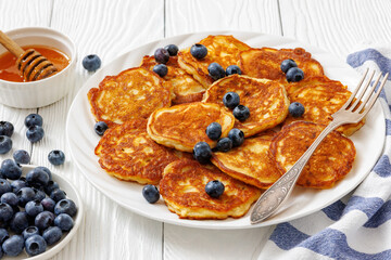 fried hot and crispy pancakes with blueberries