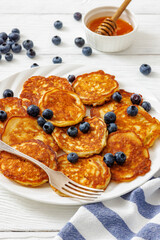 fried hot and crispy pancakes with blueberries