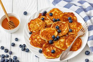 fried hot and crispy pancakes with blueberries