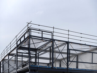 Multi-level scaffolding system with safety nets on building construction site