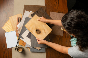 Designer Choosing Wood Samples with Coffee
