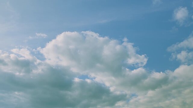 A Vast Sky Filled with Fluffy Clouds on a Beautifully Clear Day for Everyone to Enjoy