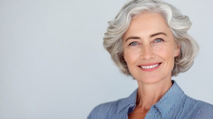 smiling beautiful mature business woman standing isolated on white background older senior businesswoman 60s grey haired lady professional female ceo coach looking at camera banner copy space no logo