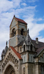 Fototapeta premium The Chapel of Ják in Budapest, a perfect architectural replica of the 13th-century Abbey Church of Ják, showcasing its stunning Romanesque features and intricate sculptural facade. 