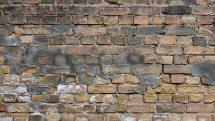brown background, in the photo an old brick wall