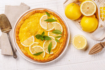 Delicious lemon tart with golden crust and smooth, glossy lemon filling
